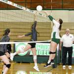 Port Angeles Jaida Wood, right, battles at the net against Olympic. Wood led the Roughriders in kills with 10 in Mondays match. (Dave Logan/for Peninsula Daily News)