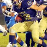 Conor Dowley/Olympic Peninsula News Group Walker Ward breaks through the line during the third quarter of the Sequim Wolves 36-21 win over the Bremerton Knights on Nov. 1. Ward was a reliable workhorse on the night, with 122 yards on 24 carries, and picking up several big first downs to keep drives moving.