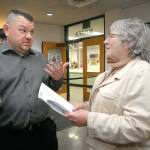 Sequim School Board candidate Eric Pickens, left, speaks with incumbent Olympic Medical Center Board Member Jean Hordyke in the lobby of the Clallam County Courthouse on Election Night in Port Angeles. (Keith Thorpe/Peninsula Daily News)