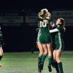 Port Angeles Millie Long (10), Hannah Reetz (center) and Bailee Larson celebrate scoring a goal against the Steilacoom Sentinels during a district playoff game at Peninsula College on Tuesday. (Jesse Major/Peninsula Daily News)
