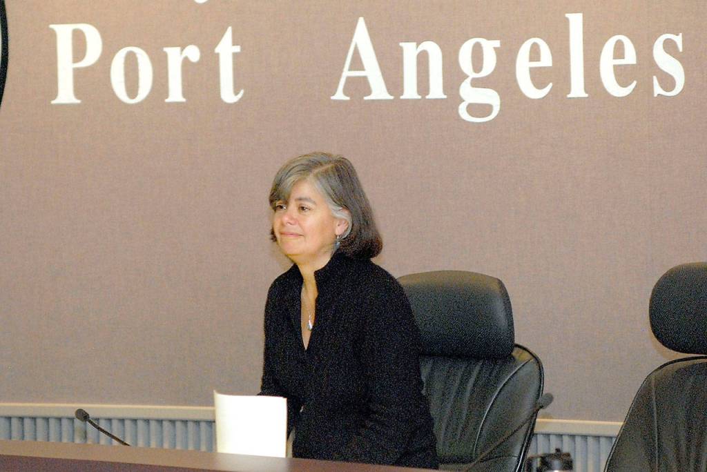 Port Angeles Mayor Sissi Bruch looks out at the audience after returning to the council table, still as mayor, after three council members voted to strip her of the title Wednesday night. (Keith Thorpe/Peninsula Daily News)
