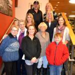 Family and friends gather to commemorate the Sequim Civic Center being named after longtime Sequim city clerk Karen Kuznek-Reese, who was unable to attend the occasion due to being in the hospital. There for the occasion were, top left, Robb Reese, husband, Paula Swisher, Washington Municipal Clerks Association (WMCA) president; second row, Carolyn Gallaway, Jefferson County deputy clerk, Virginia Olsen, WMCA immediate past president; third row, Helen Kuznek, mother, Mary Bower, retired Clallam Transit clerk, Joanna Sanders, City of Port Townsend clerk; bottom row, Sharon DelaBarre, past chairman City Arts Advisory Commission, Alicia Neal, daughter, and Brody Neal, grandson. Matthew Nash/Olympic Peninsula News Group