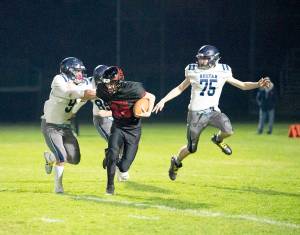 The Redhawks Joshua Davis (28) carries the ball against Sultan on Friday. Sultan won 68-18. (Steve Mullensky/for Peninsula Daily News)