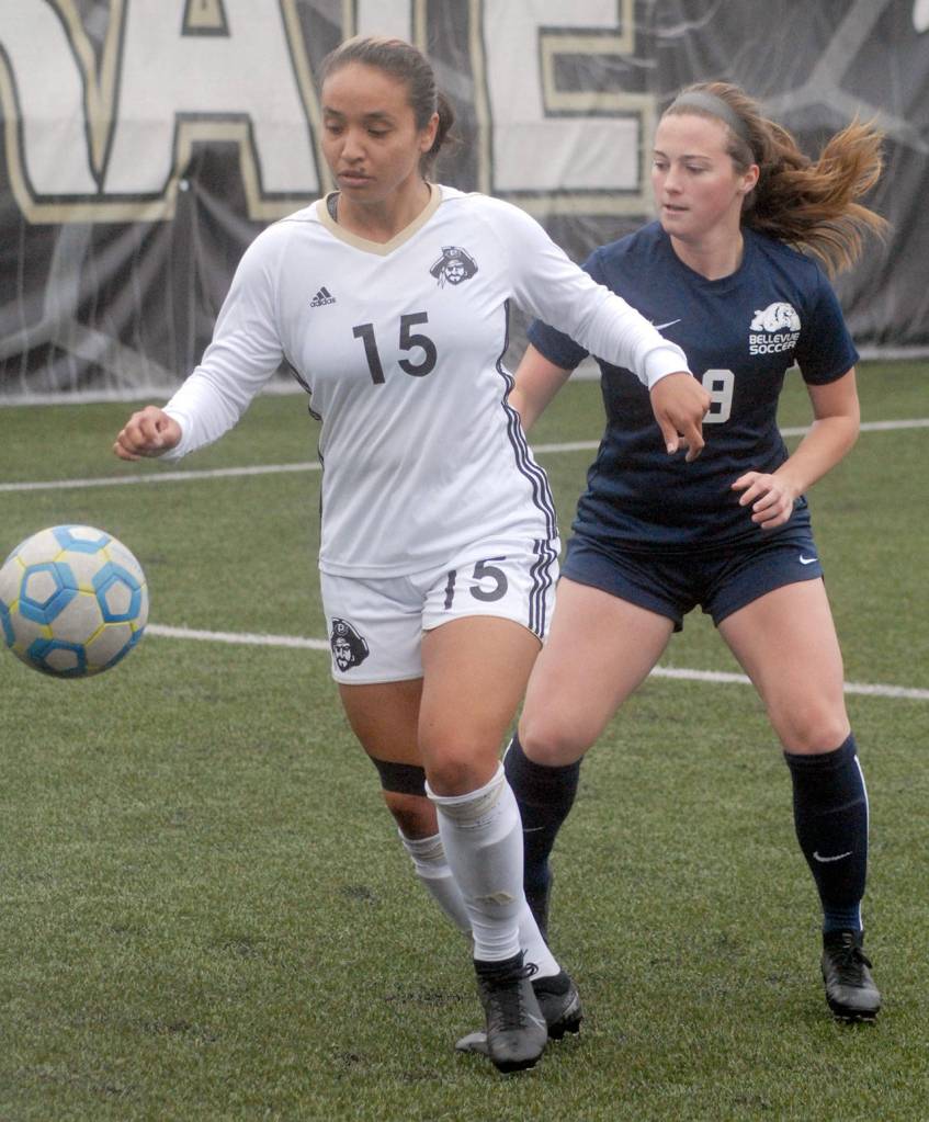 Keith Thorpe/Peninsula Daily News Peninsulas Jordan Zarate, left, is defended by Bellevues Marissa McFarland on Saturday at Wally Sigmar Field.