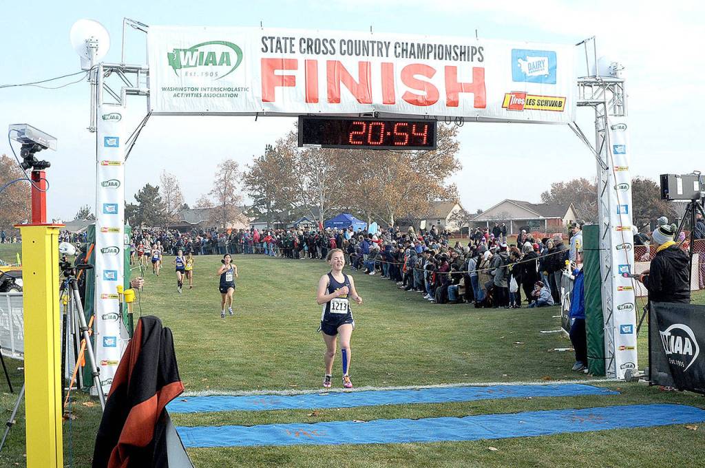 Forks Madelyn Archibald crosses the finish line at the Girls 1A State Cross-Country Championships in Pasco on Saturday. Archibald finished 50th. (Lonnie Archibald/for Peninsula Daily News)