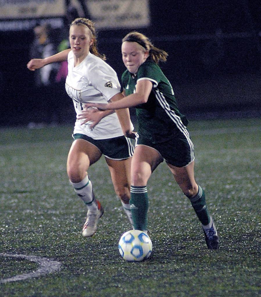 Anna Petty of Port Angeles pushes past Sehomes Ava Lunny on Tuesday nights playoff game in Port Angeles. (Keith Thorpe/Peninsula Daily News)                                Anna Petty of Port Angeles pushes past Sehomes Ava Lunny on Tuesday nights playoff game in Port Angeles. (Keith Thorpe/Peninsula Daily News)