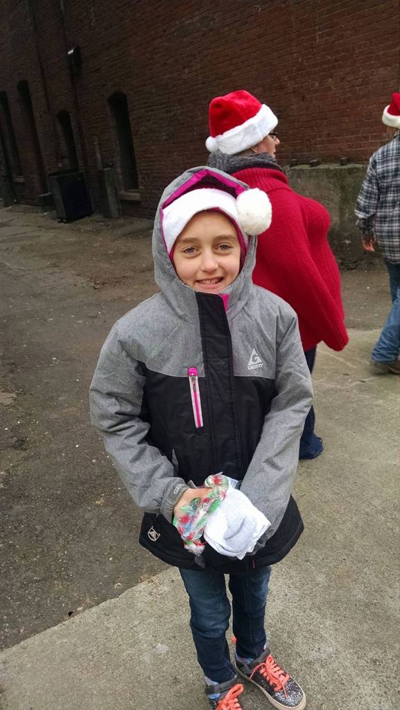 Along with handing out toiletry bags in Sequim and Port Angeles, River Jensen provides some toiletries for those on the streets in downtown Seattle in this file photo. (Anna Jensen)