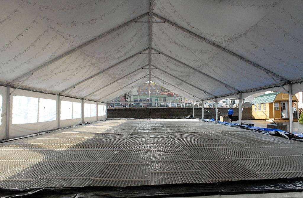 Chilling coils are spread out beneath what will become the ice skating rink at the Winter Ice Village. (Keith Thorpe/Peninsula Daily News)