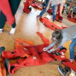 Chimacum Junior Zoe Justis packs up her immersion suit after her class had a test to see who could put on the suit within 60 seconds as part of a lesson of the Maritime Academy Skills Center class at the Port Townsend Maritime Center. (Zach Jablonski/Peninsula Daily News)