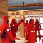 Maritime Academy Skills Center students celebrate after completing an exercise to put on their immersion suits within 60 seconds at the Port Townsend Maritime Center. (Zach Jablonski/Peninsula Daily News)