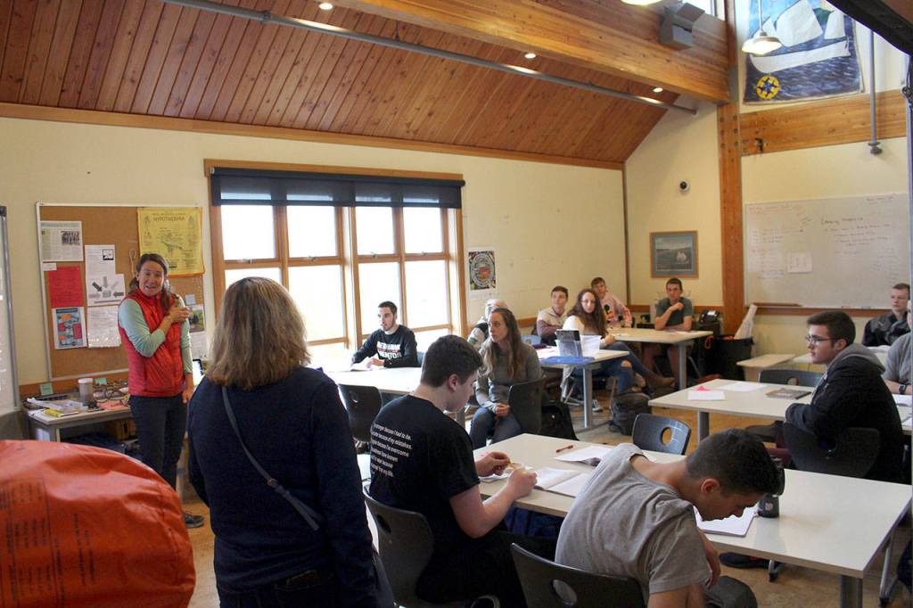 Instructor Kelley Watson speaks with West Sound Tech Director Shani Watkins during the Port Townsend Maritime Academy Skills Center class. (Zach Jablonski/Peninsula Daily News)