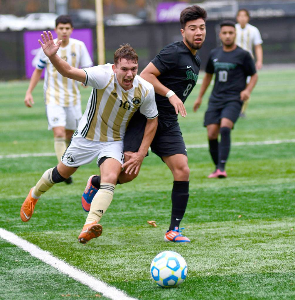 Photo courtesy Peninsula College Peninsulas Mason Haubrich, left, runs down the ball, during the Pirates 4-0 NWAC semifinal win over Chemeketa on Saturday. Haubrich converted a penalty kick in the second half to put the game out of reach.