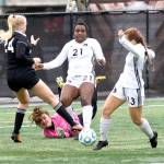 Photo courtesy of Peninsula College Peninsulas Tonnylia Dunbar (21) and Grace Hipke (13) battle for possession along with Pirates goalkeeper Andrea Kenagy and a Highline player in Sundays NWAC championship. Highline scored in overtime to win 1-0.