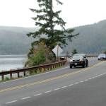 Traffic makes its way along a newly resurfaced section of U.S. Highway 101 around Sledge Hammer Point at Lake Crescent in Olympic National Park. (Keith Thorpe/Peninsula Daily News)