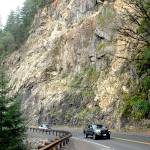 A section of U.S. Highway 101 at milepost 229 beneath a feature known as the rock wall is the only stretch of the road around Lake Crescent remaining to be repaved. (Keith Thorpe/Peninsula Daily News)
