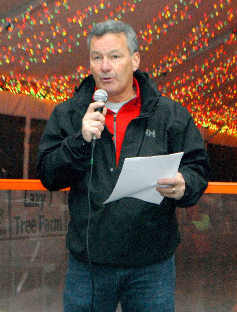 Port Angeles Regional Chamber of Commerce President Jim Haguewood offers words of appreciation to sponsors and volunteers in the construction of the Winter Ice Village during the grand opening ceremony. (Keith Thorpe/Peninsula Daily News)
