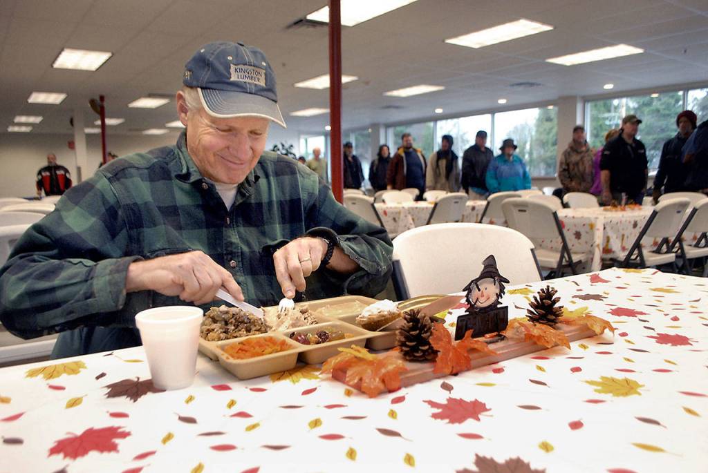 John Yeo of Sequim sits down to a traditional turkey dinner during Wednesdays Thanksgiving Eve meal at the Port Angeles Salvation Army kitchen. (Keith Thorpe/Peninsula Daily News)