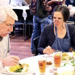 St. Pauls Episcopal Churchs Thanksgiving meal organizer Elizabeth Bindschadler takes a break to eat with her husband, Bob, during the churchs Wednesday community Thanksgiving meal, where Elizabeth was helping keep more than 20 volunteers organized and the meal running smoothly. (Zach Jablonski/Peninsula Daily News)