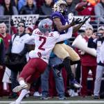 Washington State cornerback Derrick Langford, left, breaks up a pass intended for Washington wide receiver Terrell Bynum during the first half of an NCAA college football game, on Friday, Nov. 29, 2019 in Seattle. (AP Photo/Stephen Brashear)