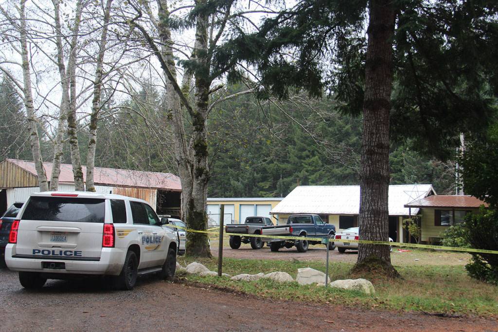 Law enforcement gathers at a house on the 1300 block of Big Burn Place in Forks after police said a 19-year-old man was shot and killed early Sunday morning. (Christi Baron/Olympic Peninsula News Group)