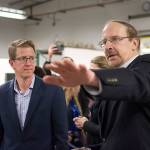 Composite Recycling Technology Center CEO Dave Walter, right, continues the tour of the center. (Jesse Major/Peninsula Daily News)
