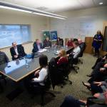 Officials from the Port of Port Angeles, Pennies for Quarters and First Federal pack into the conference room at the Composite Recycling Technology Center during a meeting with U.S. Rep. Derek Kilmer. (Jesse Major/Peninsula Daily News)