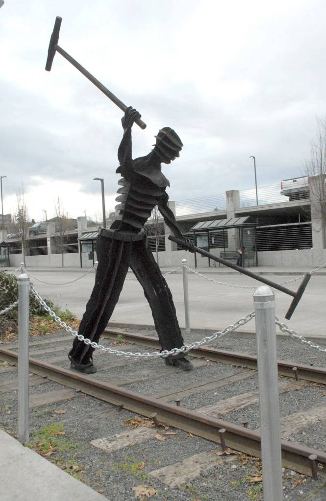 The sculpture Gandy Dancer by artist Jim Mattern stands at its current location at The Gateway transit center in downtown Port Angeles after being displaced twice since its acquisition in 2003. (Keith Thorpe/Peninsula Daily News)