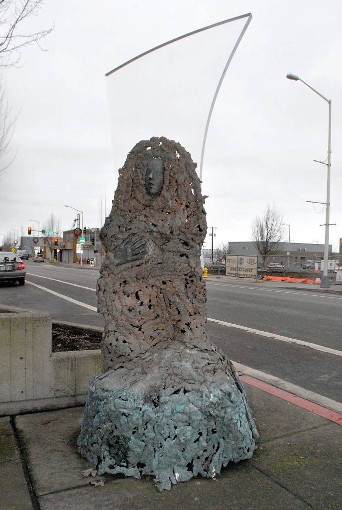 The bronze and acrylic sculputure Robert stands in a temporary location at the crosswalk in the 100 block of East Front Street after being displaced twice by construction. (Keith Thorpe/Peninsula Daily News)