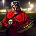 Mark Charles of the Lower Elwha Klallam Tribe leads a song during the vigil for Tristen Pisani at Spartan Stadium in Forks on Thursday. (Jesse Major/Peninsula Daily News)