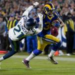 Los Angeles Rams running back Todd Gurley, right, scores past Seattle Seahawks cornerback Tre Flowers during the second half of an NFL football game Sunday, Dec. 8, 2019, in Los Angeles. (AP Photo/Kyusung Gong)
