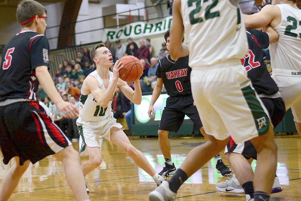 Port Angeles Dru Clark looks for a shot during the first half against Neah Bay Wednesday. (Jesse Major/Peninsula Daily News)