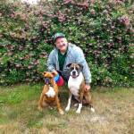 Port Angeles High School teacher Peter Rennie is pictured with Tripp, left, and Oscar.