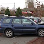 A Suburu Forester hit three other parked vehicles, pushing the third into two others, in the parking lot of Jefferson Healthcare this morning. (Zach Jablonski/Peninsula Daily News)