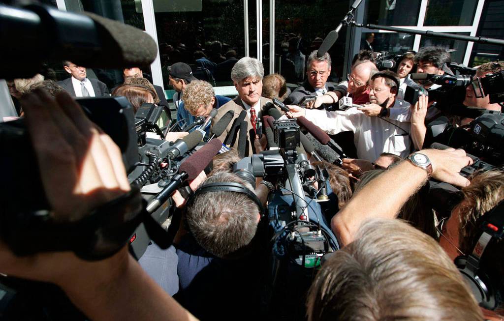 Public defender Thomas Hillier, center, answers questions from the media outside the Federal Courthouse in Seattle on July 27, 2005, after his client, Ahmed Ressam, was sentenced to 22 years in prison by U.S. District Judge John C. Coughenour for plotting to blow up the Los Angeles airport on the eve of the millennium. (Kevin P. Casey/The Associated Press, file)