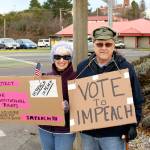 Rally organizer Michael Cornfoth, right, stands with Linda Martin during the Port Townsend Indivisible Groups rally supporting the impeachment of President Donald Trump.