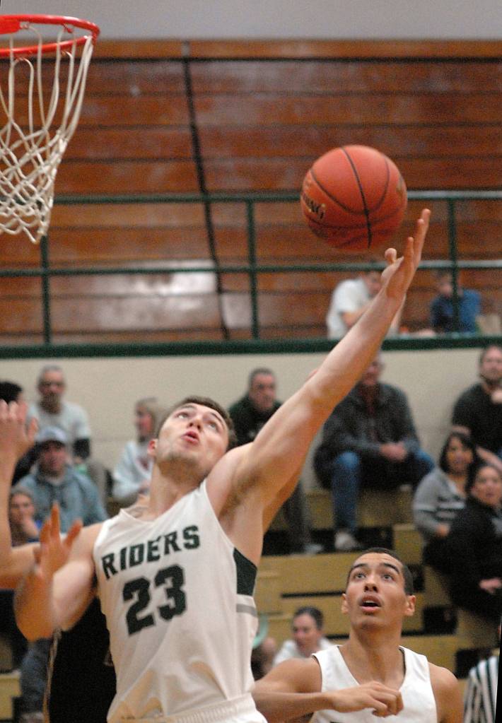Port Angeles Anthon Kathol, left, takes the shot as teammate Damen Ringgold looks on in Wednesday nights game against North Kitsap. (Keith Thorpe/Peninsula Daily News)