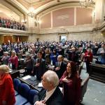 House and Senate members and guests stand Jan. 15 for the national anthem during a joint session of the state Legislature for the State of the State address by Gov. Jay Inslee in Olympia. (Elaine Thompson/The Associated Press, File)