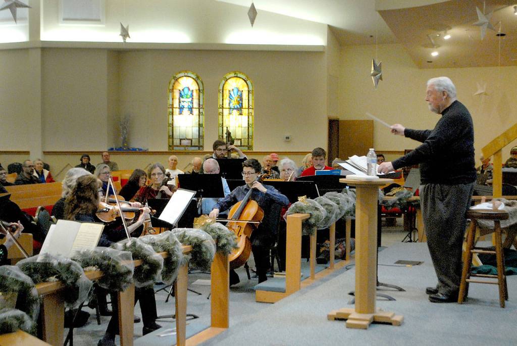 Jerome L. Wright conducts the orchestra during the overture to Handels Messiah on Saturday in Sequim. (Keith Thorpe/Peninsula Daily News)