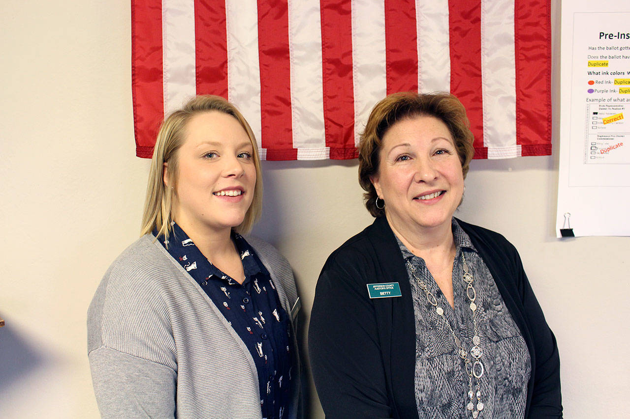 The new Jefferson County Election Coordinator Quinn Grewell stands with the now retired election coordinator Betty Johnson on Monday in the Auditors Office of the Jefferson County Courthouse. Johnson retired after working for the county on the election team for 25 years, the last six serving as the election coordinator. (Zach Jablonski/Peninsula Daily News)