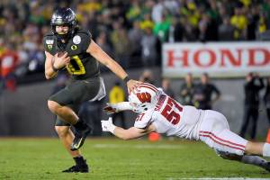ROSE BOWL: Herbert scores three TDs as Oregon beats Wisconsin