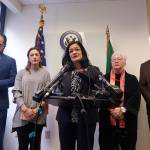 Rep. Pramila Jayapal, D-Wash., center, addresses a news conference as she stands with Masih Fouladi, left, Negah Hekmati, Diane Narasaki and Jorge Baron and talks about Hekmatis delay returning to the U.S. from Canada. (AP Photo/Elaine Thompson)
