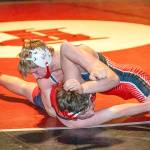 Port Townsends Ian Linn-Glasgow pins Seattle Academys Jack Cunard during a competition at Port Townsend High School on Wednesday. (Steve Mullensky/for Peninsula Daily News)