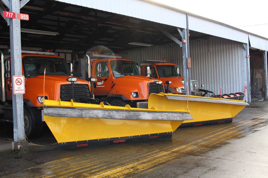 Three of the 10- to 11-foot-long snow plows for Jefferson County Public Works are lined up and ready for possible snow over the weekend and next week. Public works has five of these trucks located in Port Hadlock, three in Quilcene and two in West Jefferson County. The team also has two smaller plows that dont need a Commercial Drivers License to drive on standby in Port Hadlock, as well as one at the west end. (Zach Jablonski/Peninsula Daily News)