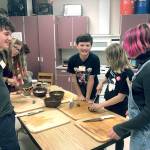 Students at Blue Heron Middle School participate in a cooking class put on by the Food Co-op. Pictured are Callen Johnson, left, Samara Kingfisher, Cadin Keever, Eden Jackson, and Sage Brotherton. (Zach Jablonski | Peninsula Daily News)
