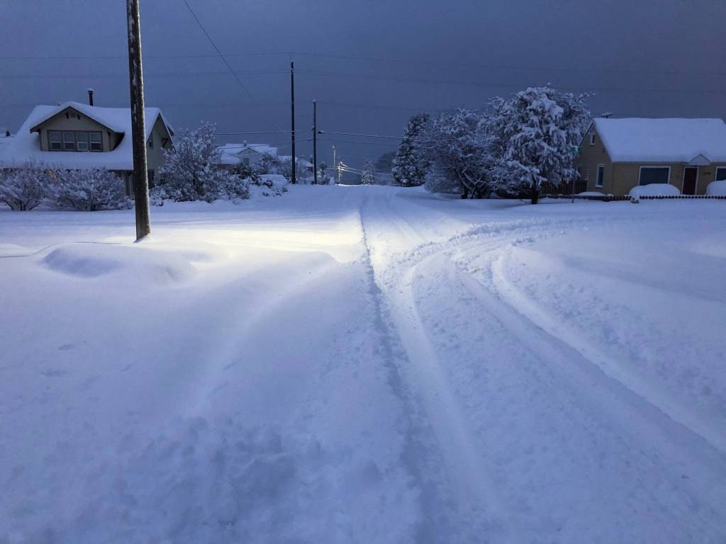 Snow covers the roadway at Sixth and D streets in Port Angeles on Wednesday morning. (Mark Swanson)