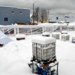 Heavy snow covers ice-making equipment next to the collapsed tent that once covered the skating rink of the Port Angeles Winter Ice Village on Wednesday morning. (Keith Thorpe/Peninsula Daily News)