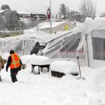 The collapsed tent covering the ice skating rink at the Port Angeles Winter Ice Village sags under the weight of tons of snow on Wednesday morning. (Keith Thorpe/Peninsula Daily News)