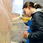 Aurora Faase adjusts the skirt on Jellyfish, her piece for the Student Wearable Art Show this Saturday. (Diane Urbani de la Paz/for Peninsula Daily News)                                Aurora Faase adjusts the skirt on Jellyfish, her piece for the Student Wearable Art Show this Saturday. (Diane Urbani de la Paz/for Peninsula Daily News)