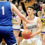 Sequim guard Dallin Despain, right, sets up for a mid-range shot against North Mason on Wednesday. (Conor Dowley/Olympic Peninsula News Group)