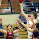 Port Angeles John Vaara goes up and over a collection of Kinston defenders for a layup during Wednesday nights game in Port Angeles. (Keith Thorpe /Peninsula Daily News)